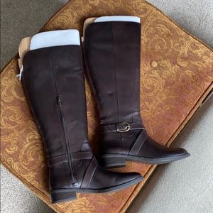 NEW- Never worn leather brown boots. Stretch calf.